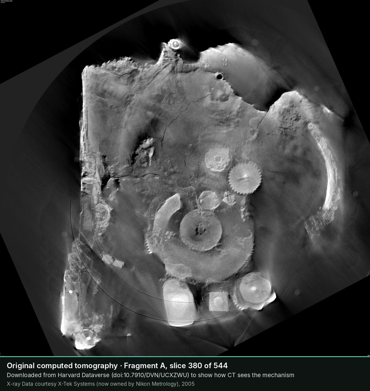 Slice 380 of the CT scan of Fragment A: Deeper: a large disc and smaller gears.