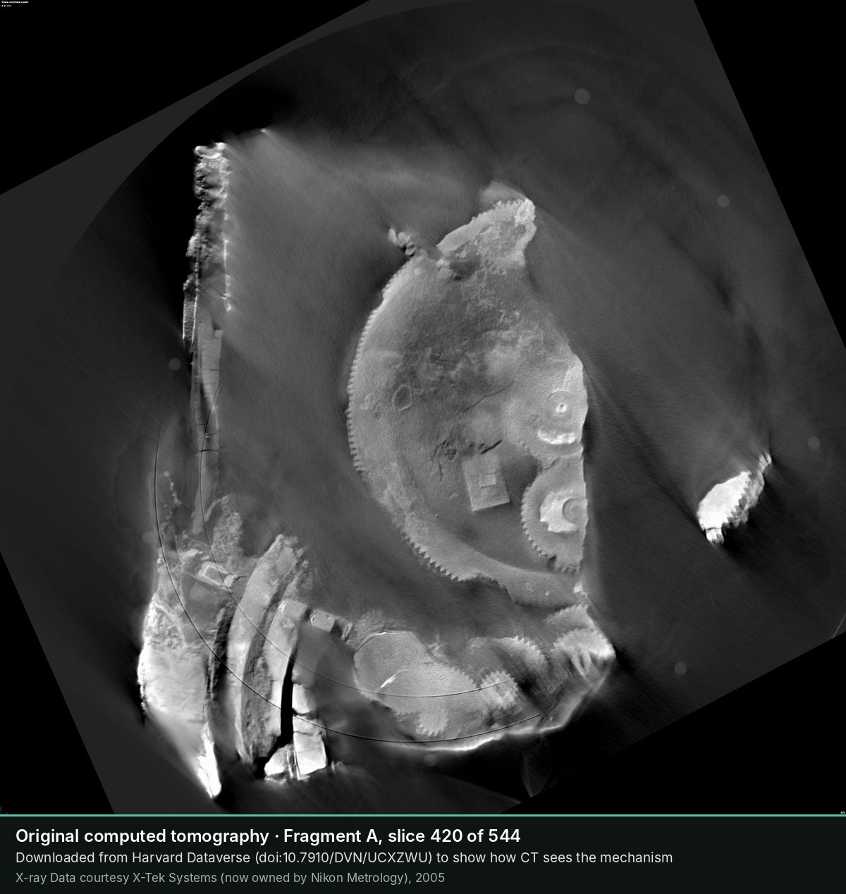 Slice 420 of the CT scan of Fragment A: The toothed rim of a large wheel and, on the right, smaller gears.