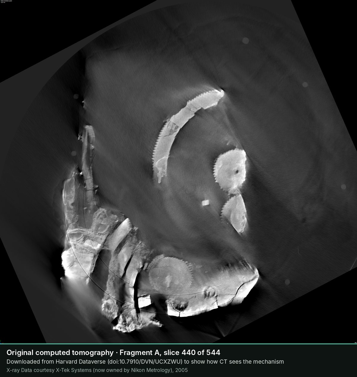 Slice 440 of the CT scan of Fragment A: Towards the back: the toothed arc of a large wheel and two smaller gears side by side.